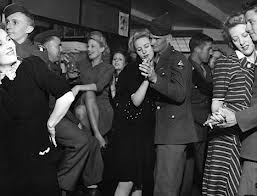 Girls mixing with GIs soldiers in a London bar World War Two