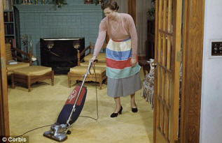 woman doing housework and vacuuming hoovering