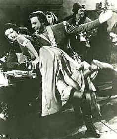 Errol Flynn spanking woman's bottom